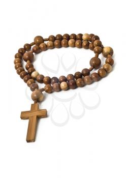Wooden beads isolated over white with focus on cross (shallow DOF)