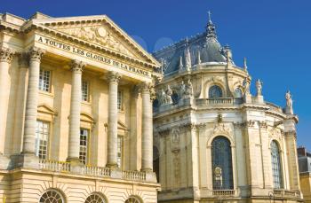 Beautiful palace facade with columns and statues in Versailles, France