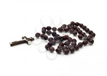 Closeup of beautiful Wooden beads isolated over white (shallow DOF). Focused on the cross