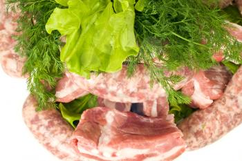 Close-up of Pork Meat, Sausages, salad and green dill