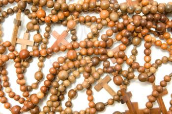Large group of Wooden rosary beads over white