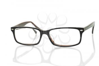 Modern glasses with reflection over white background