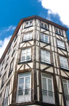 Old Studwork house facade in Rouen, France and blue sky 