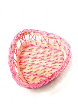 Pink woven basket for gifts over white background