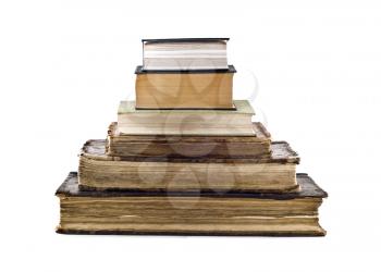 Pyramid stack of old books isolated over white