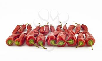 Red hot spicy paprika over white background (Shallow DOF)
