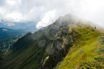 Carpathian mountains in Ukraine and hiking: landscape and cloudy sky in summer