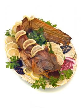 Catfish or sheatfish with lemon and parsley on the plate