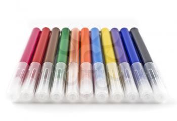Colorful felt-tip markers (pen) over white background (shallow DOF)