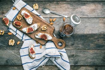 snacks with cheese jam and figs on wood. Breakfast, lunch food photo