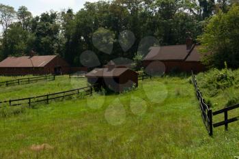 Royalty Free Photo of Outbuildings and a Field