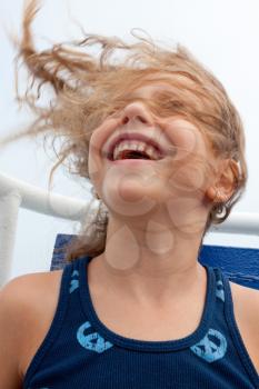 Royalty Free Photo of a Girl on an Amusement Park Ride With Her Hair Blowing