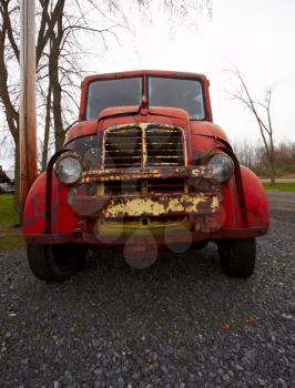 Old rusted car on the farmland.