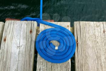 Coiled rope rigging on a jetty.