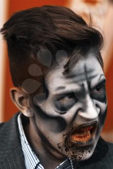 Jackson, USA-September 24, 2016: Street performer in Halloween costume and makeup is entertaining crowds.