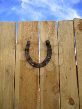 lucky horseshoe on a wooden background