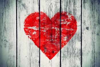 love symbol on old wooden wall background