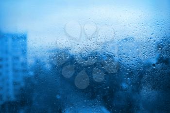 Background with natural drops of water on window glass