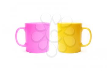 Two colored ceramic cups isolated on a white background
