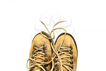 Yellow shoes with untied shoelaces on white background