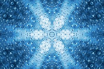 Blue abstract pattern of water drops on glass 