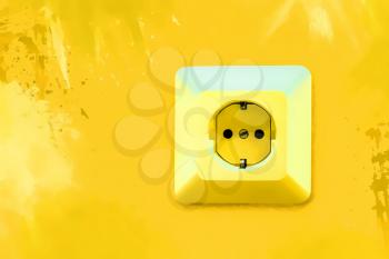 Electric socket on bright yellow wall with blots