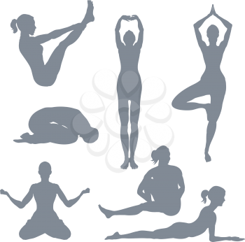 Royalty Free Clipart Image of a Set of Yoga Posture Silhouettes