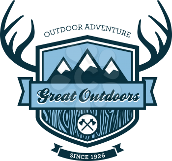 Wood themed outdoors emblem with mountains and antlers