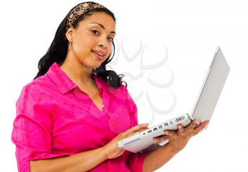 Royalty Free Photo of a Young Woman Holding a Laptop and Smiling at the Camera