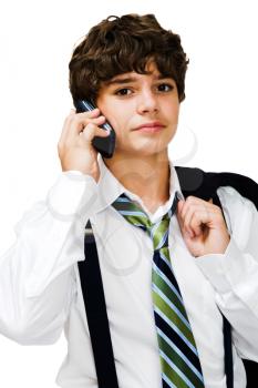 Royalty Free Photo of a Young Boy Modeling Clothing and Talking on a Cellular Phone