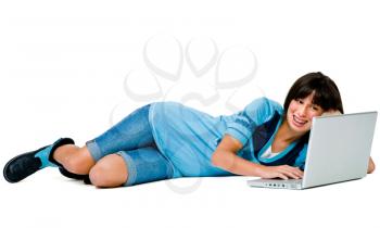 Royalty Free Photo of a Teenage Girl on the Floor Using a Laptop