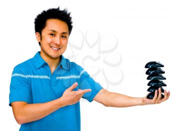 Royalty Free Photo of a Man Holding a Stack of Computer Mouses