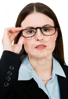 Royalty Free Photo of a Businesswoman Adjusting her Glasses