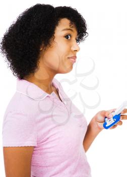 Royalty Free Photo of a Young Girl Texting on her Cell Phone