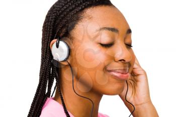 Royalty Free Photo of a Woman Enjoying Music Through a set of Headphones