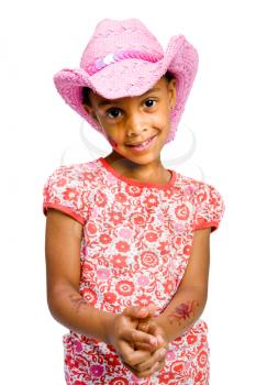 Royalty Free Photo of a Young Girl Wearing a Pink Cowgirl Hat 