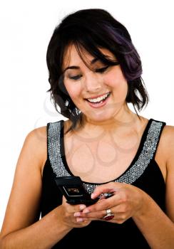 Royalty Free Photo of a Woman smiling and Texting on her Mobile Phone
