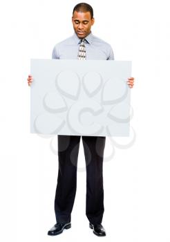 Royalty Free Photo of a Businessman Holding a Blank Placard