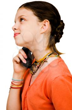 Royalty Free Photo of a Profile of a Young Girl Talking on a Mobile Phone