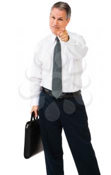 Royalty Free Photo of a Businessman Holding a Briefcase and Pointing