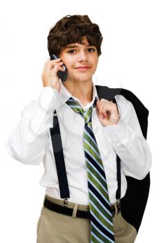 Boy talking on a mobile phone and smiling isolated over white