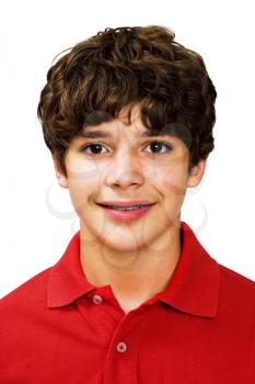 Portrait of a boy posing and smiling isolated over white