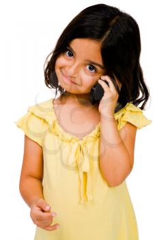 Smiling girl talking on a mobile phone isolated over white
