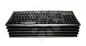 Stack of keyboards isolated over white