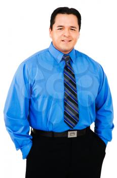 Businessman standing with his hands in his pockets isolated over white