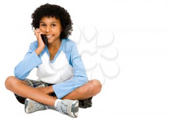 Child talking on a mobile phone isolated over white