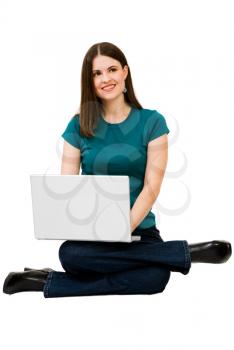 Happy woman using a laptop isolated over white