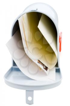 Letters in a mailbox isolated over white