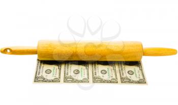 Close-up of a rolling pin on us paper currency isolated over white
