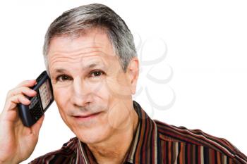 Close-up of a businessman talking on a mobile phone isolated over white